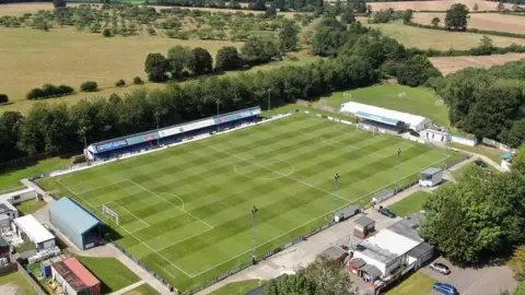Tonbridge Angels Football Club An aerial view of a football stadium.