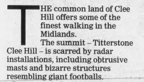 Worcester News A newspaper clipping from the Worcester news in August 2008, which reads: "The common land of Clee Hill offers some of the finest walking in the Midlands. The summit - Titterstone Clee Hill - is scarred by radar installations, including obtrusive masts and bizarre structures resembling giant footballs."