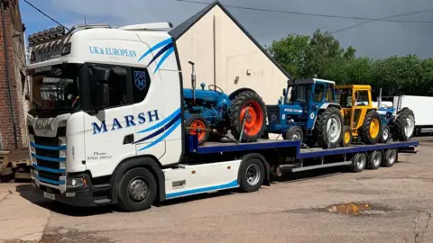 Jackie Jones Tractors loaded onto lorry