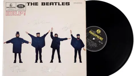 Signed LP cover by Anderson & Garland Auction Help! by The Beatles.