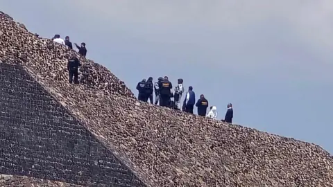 EPA Police officers and forensic experts secure the area on a pyramid where a shooting occurred at the Teotihuacan archaeological site in Mexico, 20 April 2026.
