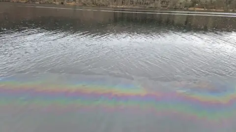 a rainbow slick from a fuel leak on a roer
