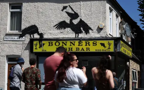     EPA-EFE/REX/Shutterstock Banksy's pelicans over Bonner's fish bar 