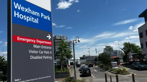 A sign points to the emergency department at Wexham Park Hospital