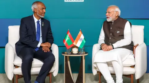 Mohamed Muizzu: Maldives president visits India amid trouble in tourist  paradise