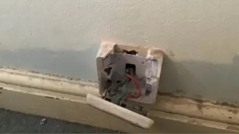 ECS (Electrical Compliance and Safety) Ltd Exposed wires in one social rented property