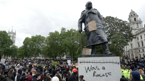 Getty Images Statue of Churchill with graffiti calling him a racist