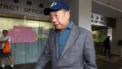 Getty Images Media tycoon Jimmy Lai Chee-ying leaves Eastern Magistrates' court 2016