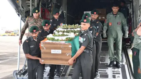 Defense PRO, Thiruvananthapuram Indian army soldiers carry the coffin containing the body of Cherian Thomas