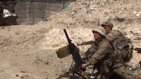 EPA Azerbaijani soldiers prepare to fire a weapon. Photo: 28 September 2020