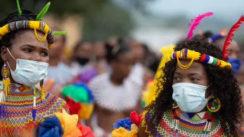 AFP Zulu women dressed in traditional beaded outfits in Nongoma, South Africa - 17 March 2021