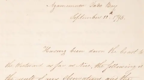 A close-up photograph shows a handwritten 1795 letter in neat cursive script on aged paper, with the heading “Agamemnon Vado Bay” and the date “September 11th 1795” clearly visible at the top.