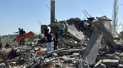 Emergency responders inspect the site of an Israeli strike in Saksakiyeh, Lebanon, on 9 May 2026.