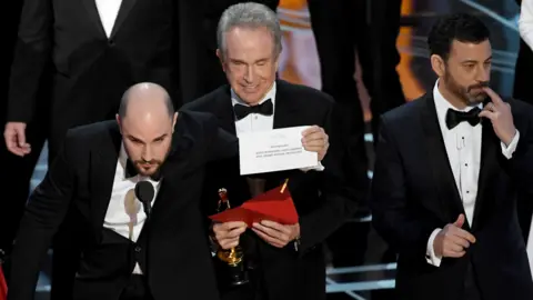 Getty Images La La Land producer Jordan Horowitz (L) holds up the winner card reading actual best picture winner Moonlight after a presentation error with actor Warren Beatty and host Jimmy Kimmel onstage during the 89th Annual Academy Awards at Hollywood & Highland Center on February 26, 2017 in Hollywood, California