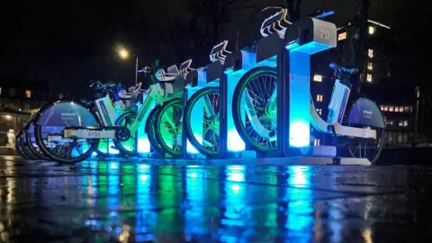 Wellies Full of Water/BBC Weather Watchers E bikes in Dundee