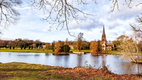 Getty Images A general view of Clumber Park in Nottinghamshire taken in front of a lake with a chapel on the other side
