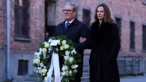 Prime Minister Sir Keir Starmer and his wife Lady Victoria, wait to lay a wreath during their visit to the Memorial and Museum Auschwitz-Birkenau, a former German Nazi concentration and extermination camp, in Oswiecim, during his visit to Poland to begin talks on a new defence and security agreement. Picture date: Friday January 17, 2025.