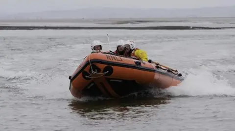 RNLI/Chris Jameson Lifeboat crew on a lifeboat going to a rescue in Fleetwood