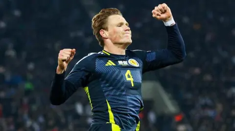 Scotland's Scott McTominay celebrates scoring to make it 1-0 during a UEFA Nations League 2024/25 League A/B Play-Off First Leg match between Greece and Scotland at Stadio Georgios Karaiskakis