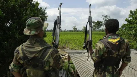 Piero Pomponi/Newsmakers Colombian paramilitaries during a crop establishment operation in early 2000.