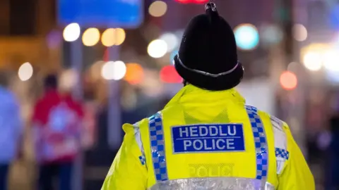 Getty Images Police officer in Cardiff at night