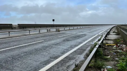 John Fairhall/BBC A closed Orwell Bridge on the edge of Ipswich