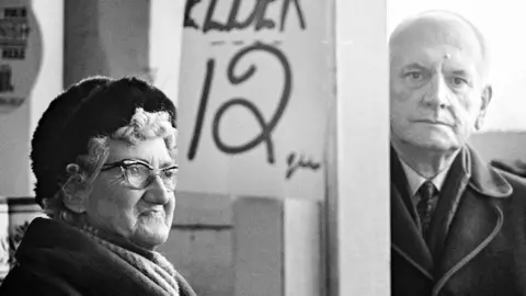 Heidi Alexander Woman and man in a shop