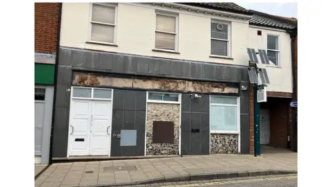 Andrew Sinclair/BBC Boarded up bank branch in Wymondham