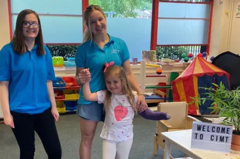 Zak Cremin Tilli with staff at the clinic in Manchester