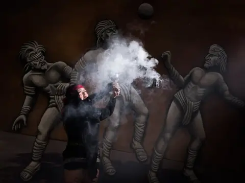 AFP Mexican Beatriz Campos, player of a pre-Columbian ballgame called "Ulama" -in Nahuatl indigenous language- performs the "Copal" ceremony ahead of a match at the FARO Poniente cultural centre in Mexico City on August 21, 2019.