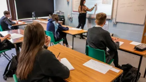 Getty Images Secondary school pupils in a socially distanced lesson