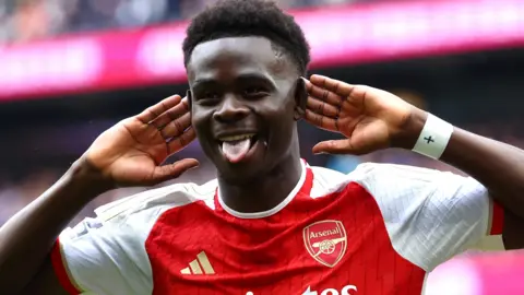 Bukayo Saka celebrates scoring for Arsenal against Tottenham Hotspur