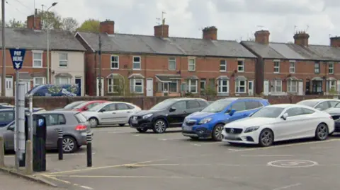 Google Maps A Google Maps street view image of a public car park in which there are several parked cars.