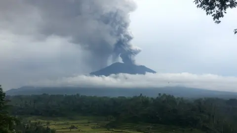 BBC Smoke and ash rise from Mount Agung