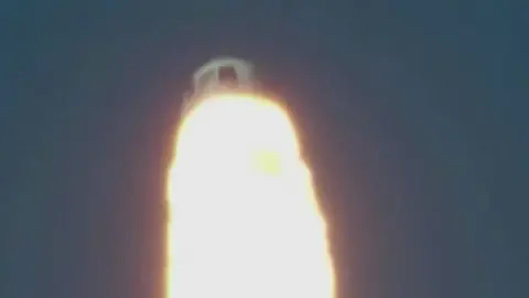 Blue Origin capsule firing thrusters