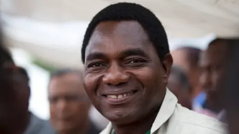 Reuters United Party for National Development (UPND) presidential candidate Hakainde Hichilema smiles during a rally in Lusaka, Zambia January 18, 2015.