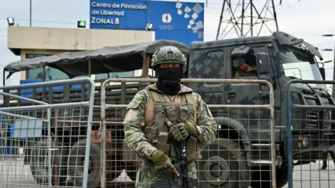 Getty Images Soldier stands outside Regional 8 prison complex