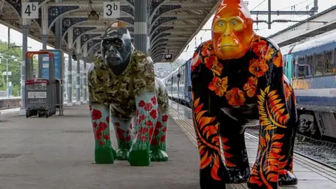 Blanc Go Go Gorillas arrive at Norwich station