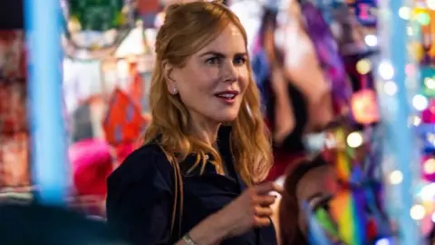 Getty Images Actress Nicole Kidman films a scene in a market in Hong Kong on August 23, 2021, from the Amazon Prime Video series titled Expats