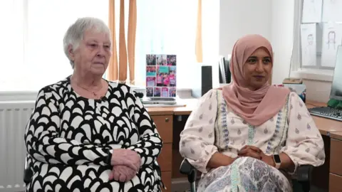 Two women sitting in an office