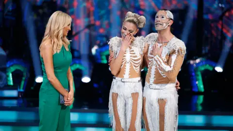 BBC Picture shows : L-R : Tess Daly, Zara McDermott and Graziano Di Prima