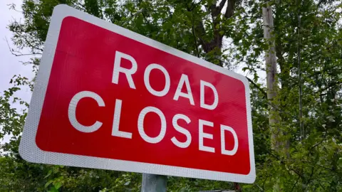 Martin Giles/BBC A 'road closed' sign