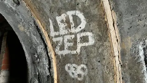BBC/Kate Bradbrook Graffiti on wall of shelter "Led Zep"