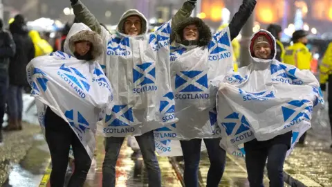 PA Media Hogmanay revellers in Edinburgh