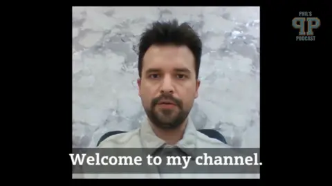 YouTube A man in front of a plain backdrop with the subtitle "Welcome to my channel"