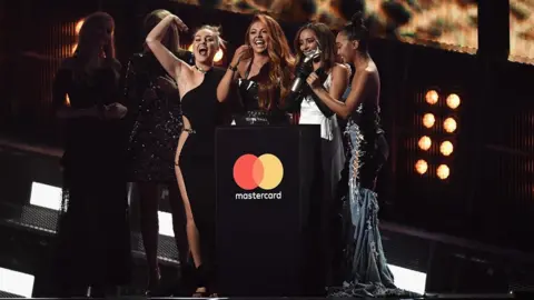 Getty Images Little Mix winning Best British Single at the Brit Awards in 2017