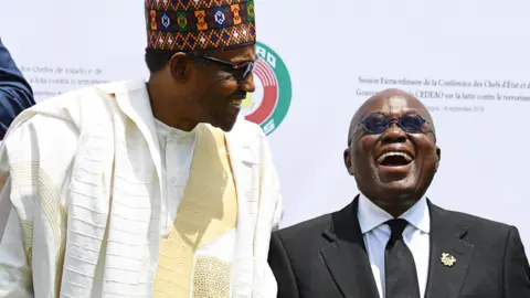 AFP Presidents Muhammadu Buhari of Nigeria and Nana Akufo-Addo of Ghana pose after the opening ceremony of an Ecowas meeting in Burkina Faso 14 September 2019
