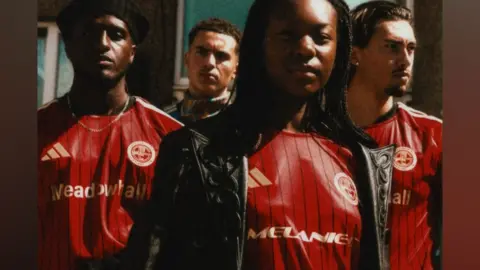 Sheffield FC A group of teenagers wearing red football shirts