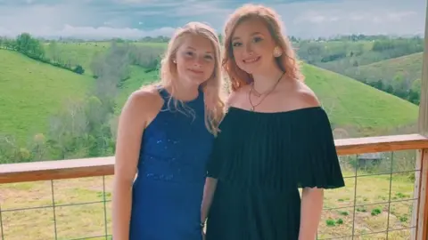 Isabella Domidion Isabella and her sister in their prom dresses