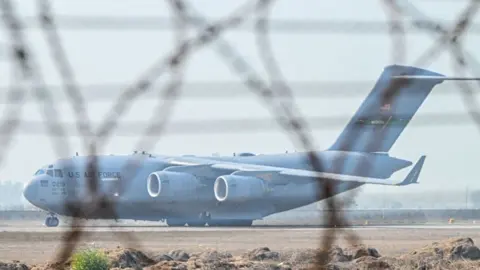 A US Air Force C-17 Globemaster III aircraft carrying undocumented migrants 